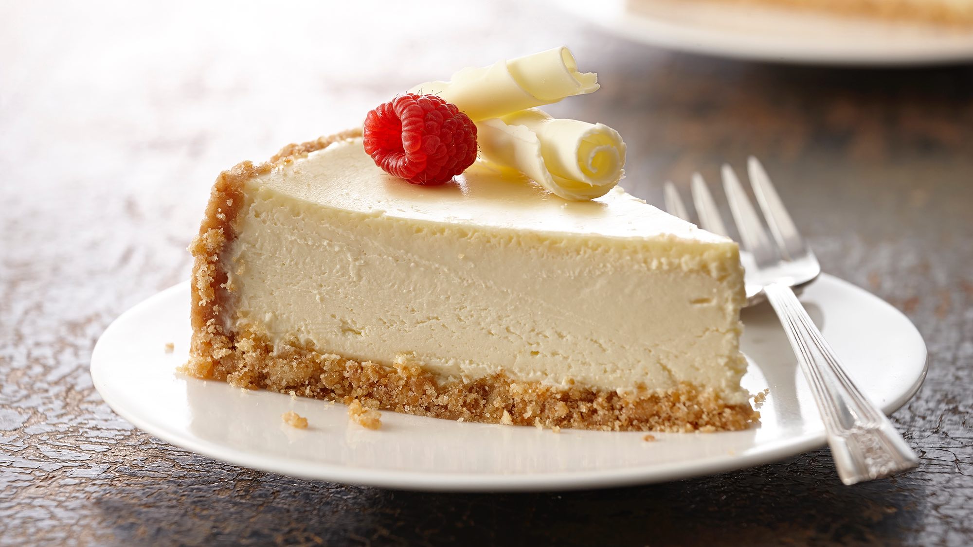 Slice of ultimate vanilla cheesecake