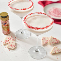 Festive holiday cocktails with rims coated in McCormick Candy Cane Finishing Sugar