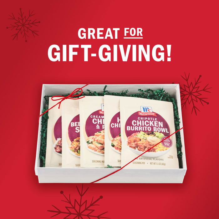 A bowl of pasta with McCormick Creamy Tuscan Chicken & Pasta seasoning mix is displayed next to a packet of the seasoning.