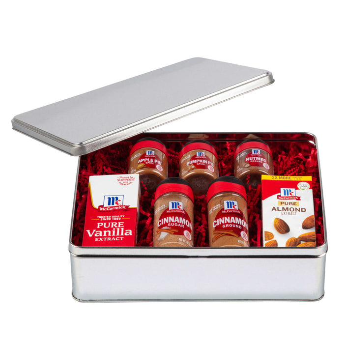 A McCormick spice gift set with a variety of spices and extracts including cinnamon nutmeg pumpkin pie spice apple pie spice vanilla extract and almond extract.