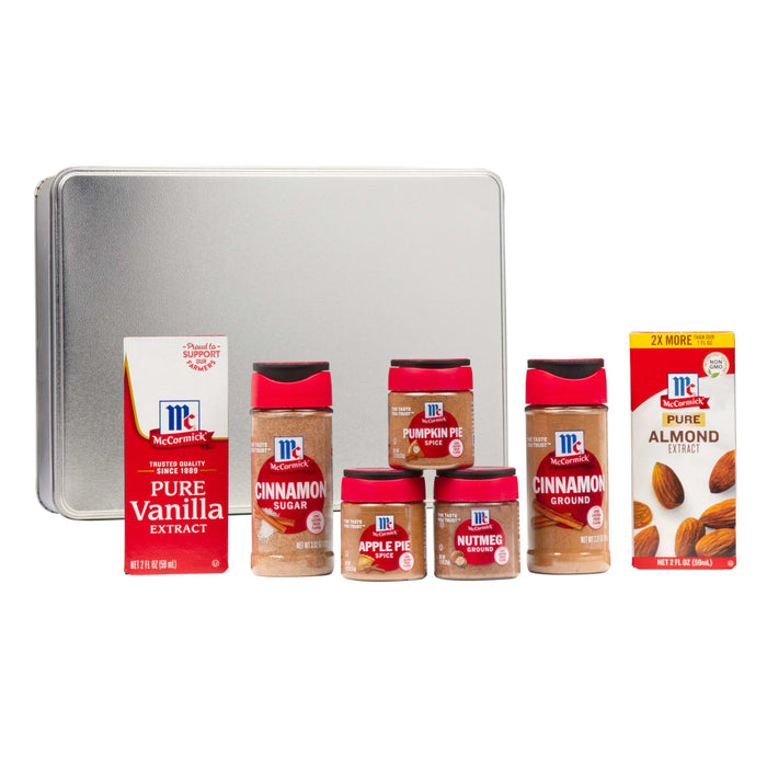 A collection of McCormick spices and extracts including vanilla cinnamon pumpkin pie spice apple pie spice nutmeg and almond extract.
