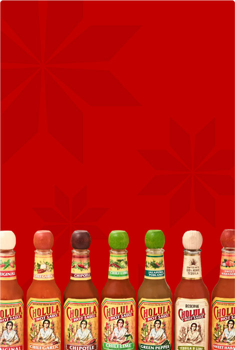 Row of Cholula hot sauce bottles on a red background