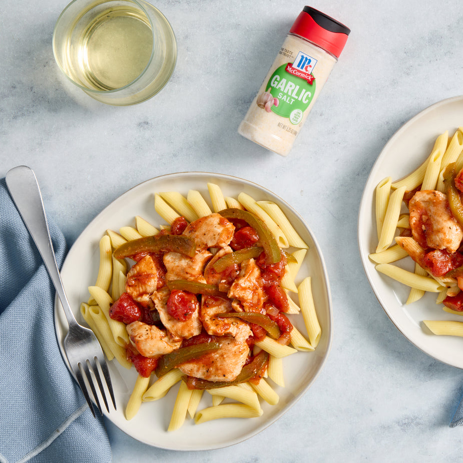 pasta and chicken on plate with garlic salt