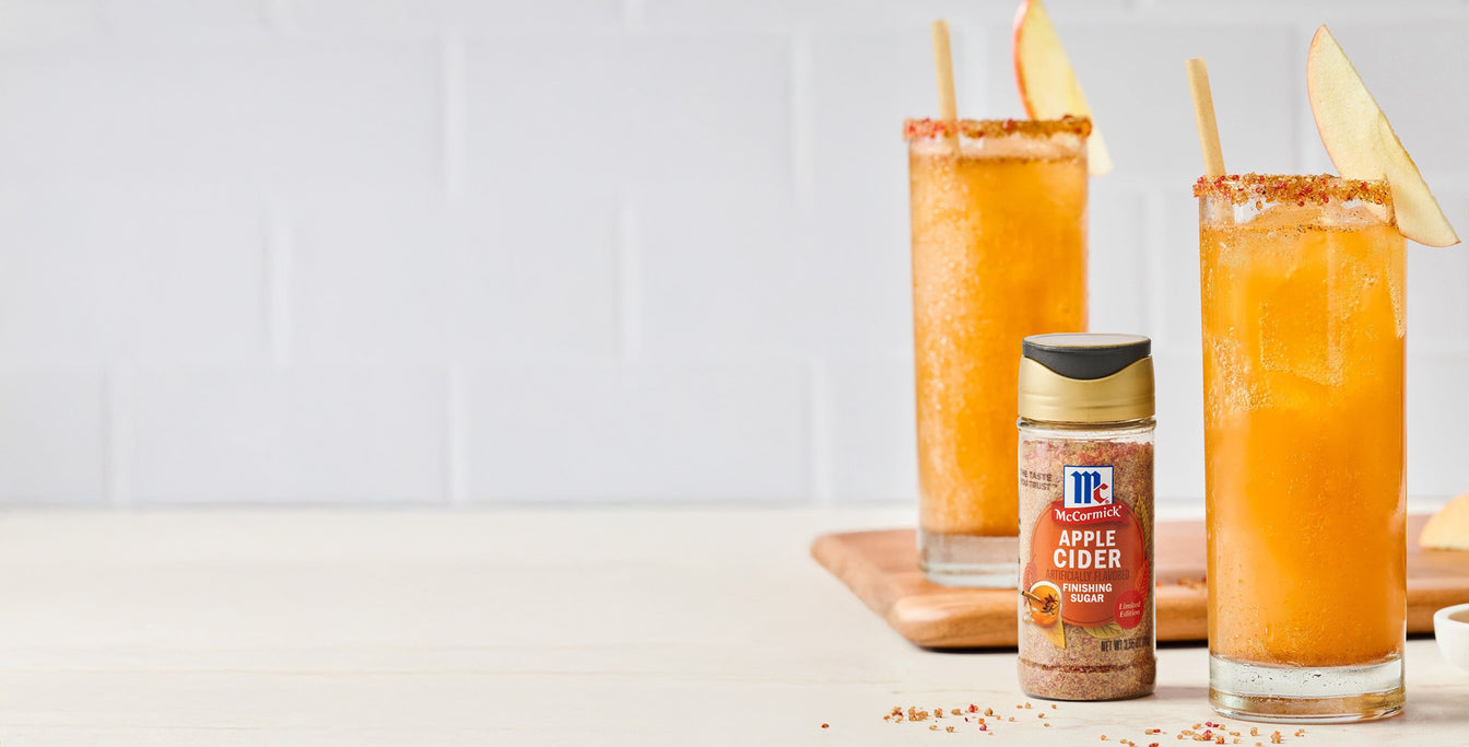Apple cider drinks rimmed with sugar, McCormick Apple Cider Finishing Sugar bottle in front