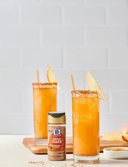 Apple cider drinks rimmed with sugar, McCormick Apple Cider Finishing Sugar bottle in front