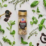 Balsamic & Herb Finishing Salt surrounded by balsamic vinegar and herbs