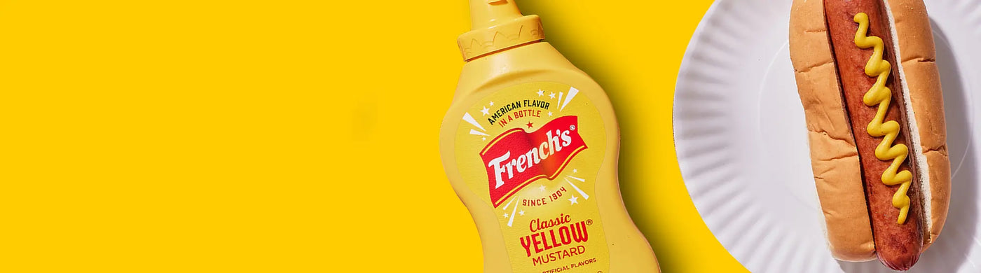 French's Yellow Mustard and a Hot Dog on a paper plate
