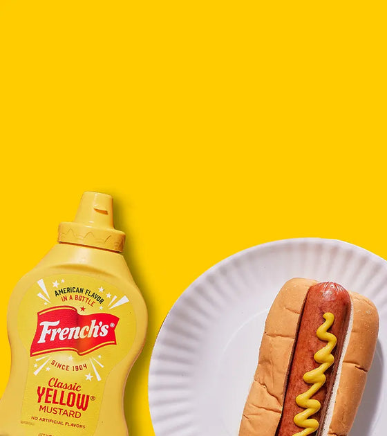 French's Yellow Mustard and a Hot Dog on a paper plate