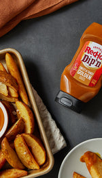 Frank's RedHot Dip'n Sauce with Wedge Fries on a baking sheet