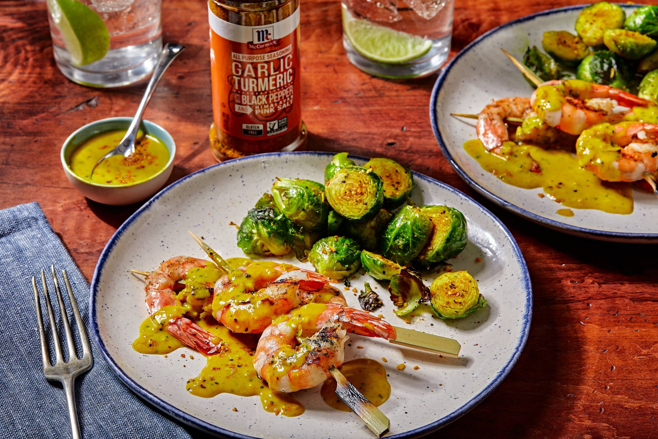 Shrimp and vegetables on plate with seasoning and sauce