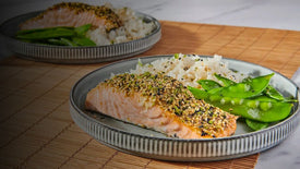 salmon on plate with rice and pea pods