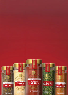 lineup of mccormick gourmet products organic thyme, organic garlic powder, organic smoked paprika, flat leaf parsley, and organic ground saigon cinnamon