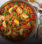 jambalaya with chicken string beans and lemon in a big skillet