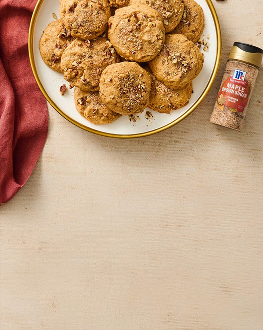 Plate of cookies with a jar of maple brown sugar on a beige surface