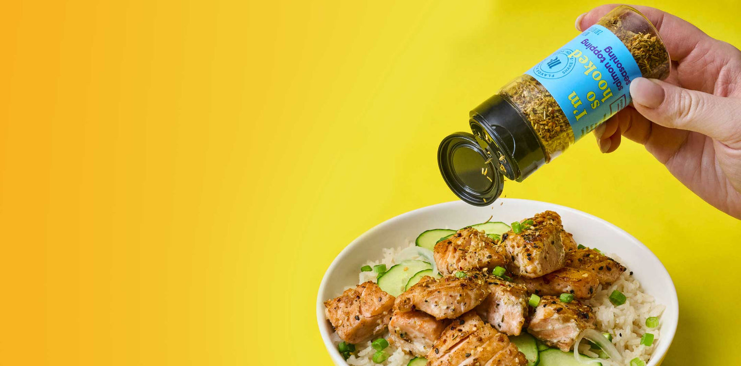 McCormick I'm So Hooked Salmon Topping being sprinkled on salmon and rice