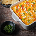 buffalo chicken dip in a white deep dish pan