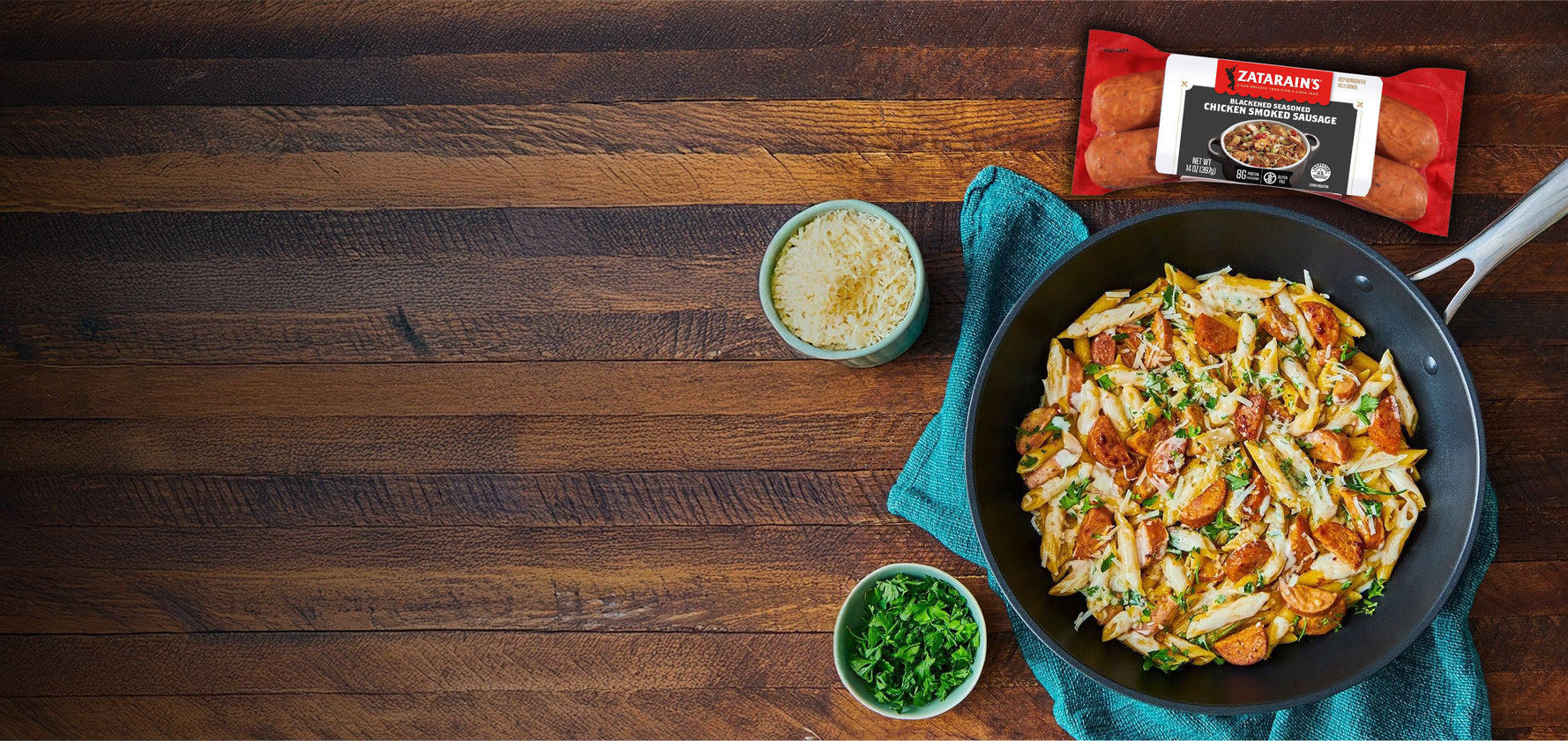 Fried pasta dish in a pan on a wooden table with a package of Zanettos meatballs.
