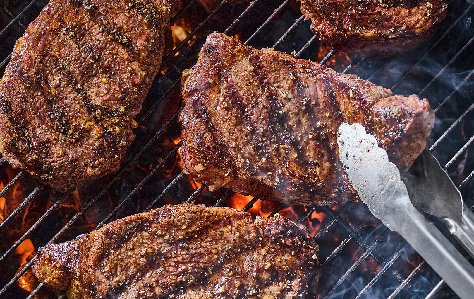 bone-in ribeye being grilled