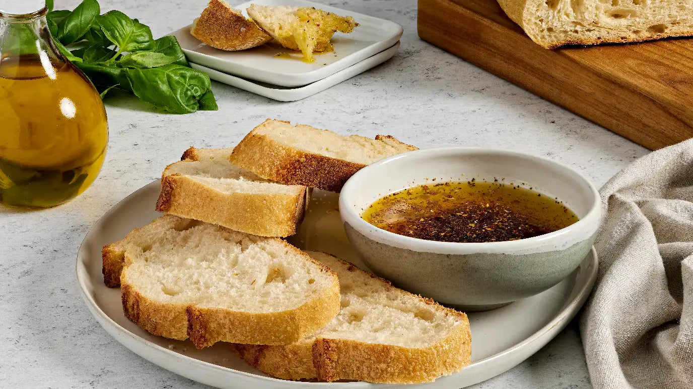 Fresh bread with spicy italian bread dip