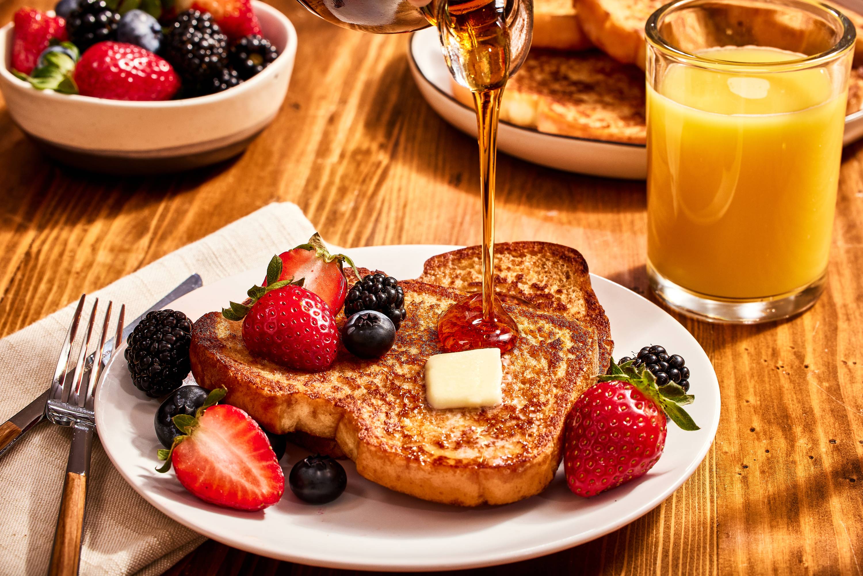 Quick and Easy french toast with butter, syrup and fresh berries