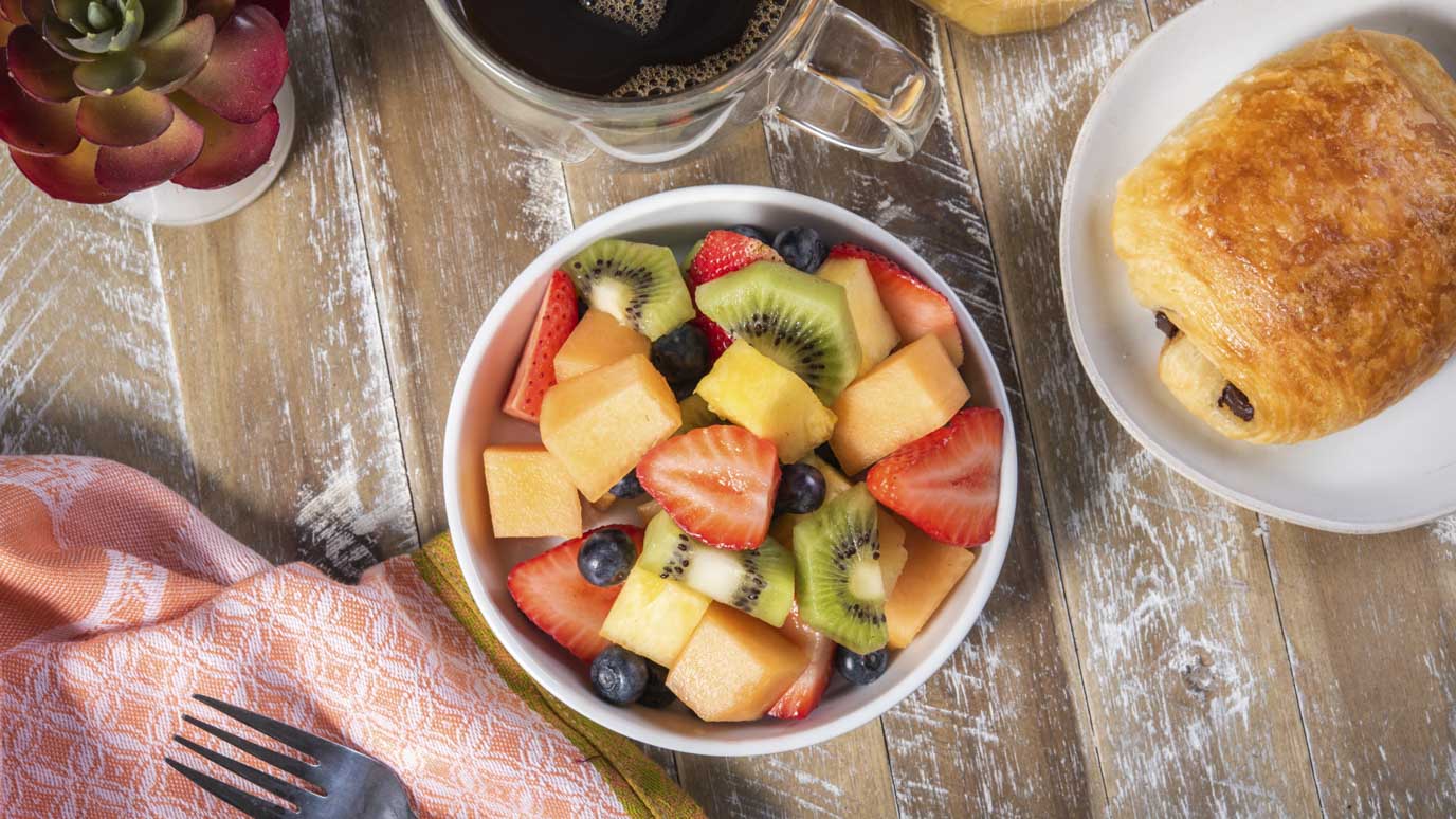 fruit salad with fresh pastries