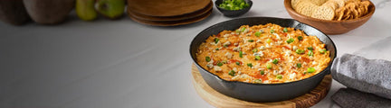 Skillet of Buffalo Chicken Dip on a table