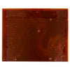 A square piece of homemade caramel candy with a rich, dark brown color and a slightly glossy surface.