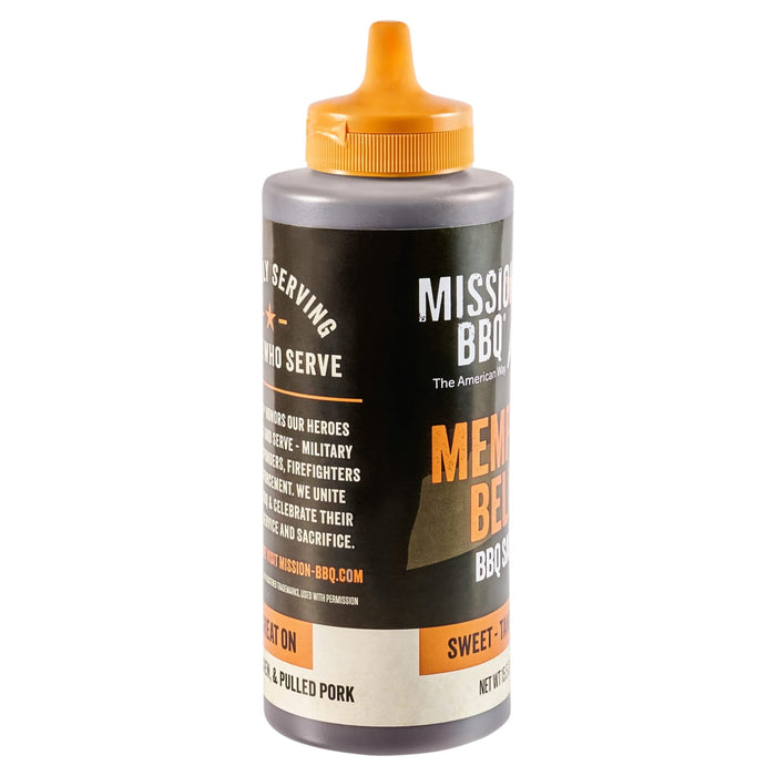 A bottle of Mission BBQ Memphis Belle BBQ sauce with an orange cap.