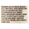 The image shows the ingredient list for a food product, including items like distilled vinegar, molasses, and spices.