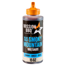 A bottle of Mission Bbq Blue Ridge Smoky Mountain 15 Oz BBQ sauce with an orange squeeze top.