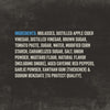 The ingredients list for Mission Bbq Blue Ridge Smoky Mountain 15 Oz is displayed on a dark textured background, detailing components such as molasses, various sugars, tomato paste, vinegars, and spices including smoke flavor and aged cayenne red peppers.