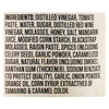The image shows the ingredient list for a food product, including items like distilled vinegar, tomato paste, sugar, and spices.