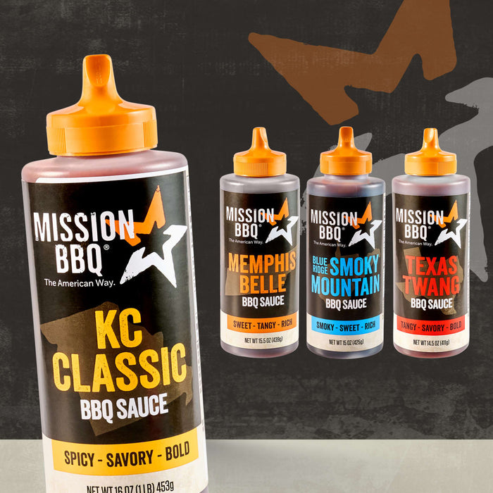 A bottle of Mission Bbq Kc Classic Bold Barbecue Sauce Plastic Squeeze Bottle 16 Oz is featured in the foreground, with three other barbecue sauce varieties from the same brand arranged behind it on a dark, textured background.
