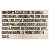 The image shows the ingredient list for a food product, including sugar, vinegar, tomato paste, spices, and garlic.