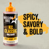 A product shot of the Mission Bbq Kc Classic Bold Barbecue Sauce Plastic Squeeze Bottle 16 Oz is displayed next to large, stylized text reading Spicy, Savory &amp; Bold to emphasize its flavor.