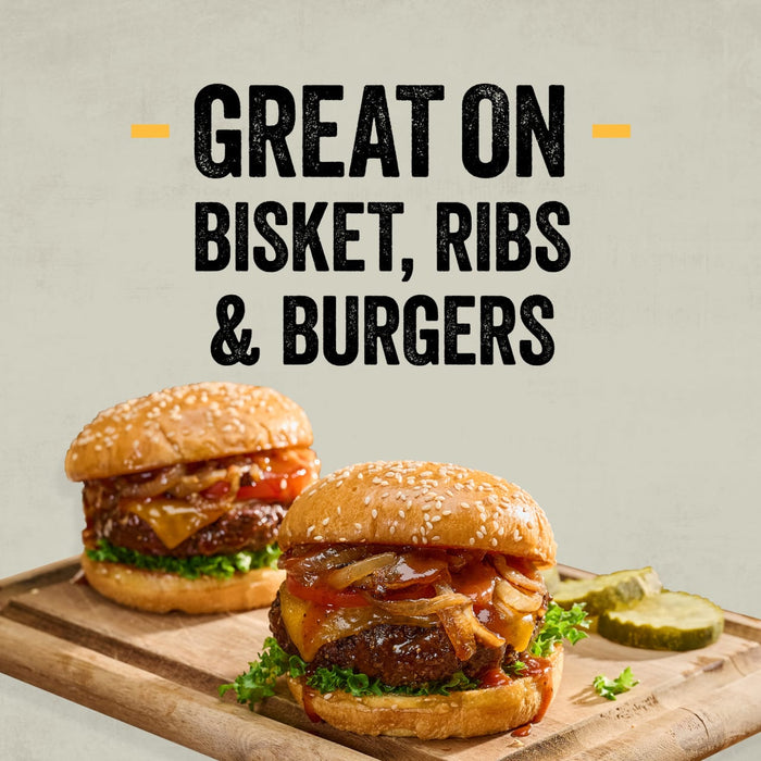 Two juicy burgers on a wooden board demonstrate how the Mission Bbq Kc Classic Bold Barbecue Sauce Plastic Squeeze Bottle 16 Oz is great on brisket, ribs, and burgers.