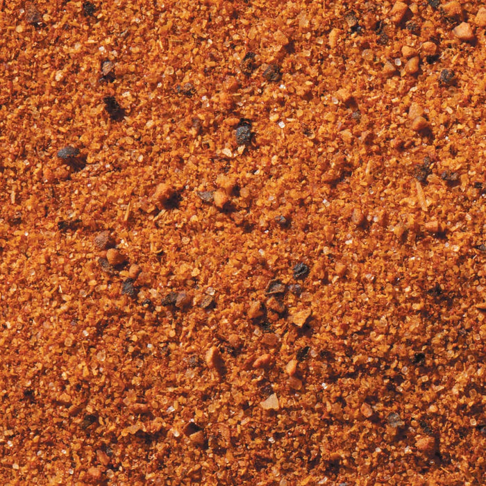 A close-up of a mixture of spices, including salt, pepper, and paprika.