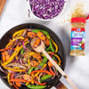 A skillet of colorful vegetables seasoned with McCormick Salt Free Vegetable Seasoning.