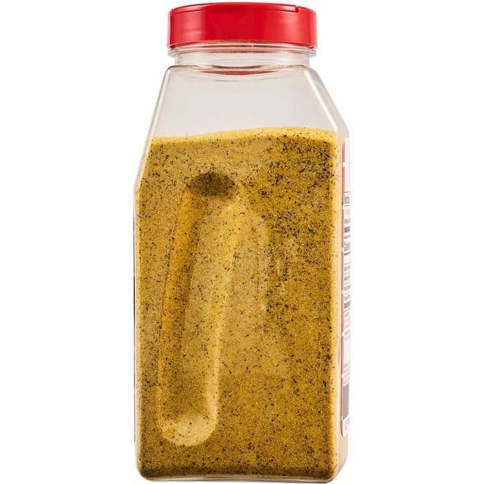 A container of a yellow spice blend with a red lid.