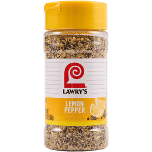 A bottle of Lawry's Lemon Pepper with zest of lemon.