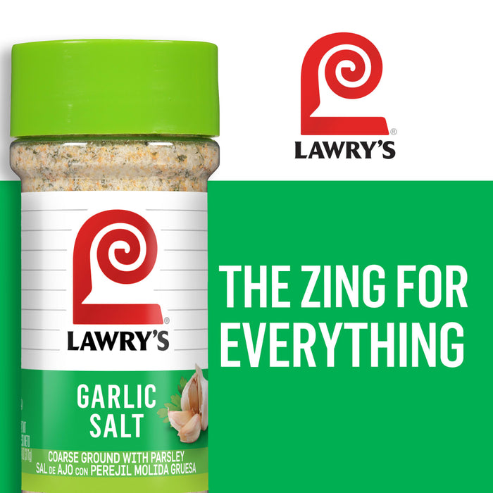 A Lawry\'s Garlic Salt container with a green lid and a white label with the Lawry\'s logo and the text The Zing for Everything on a green background.