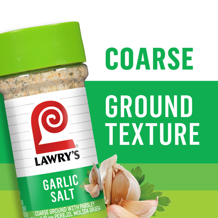 A container of Lawry's Garlic Salt with a close-up of garlic cloves and parsley.