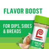 A jar of Lawry's Garlic Salt with a garlic clove and parsley in the background.