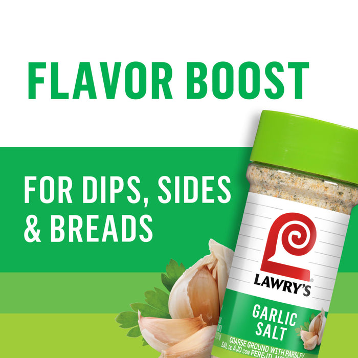 A jar of Lawry's Garlic Salt with a garlic clove and parsley in the background.