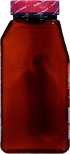 A brown glass bottle of Franks RedHot Original Hot Sauce.