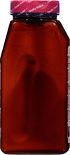 A brown glass bottle with a red lid that says Quality Sealed on it.