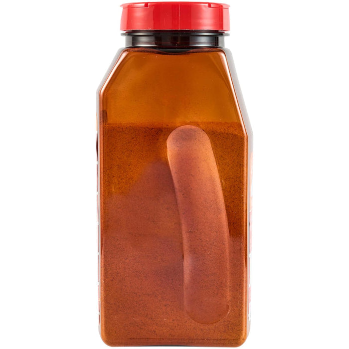 A red plastic bottle with a red lid filled with a red liquid.