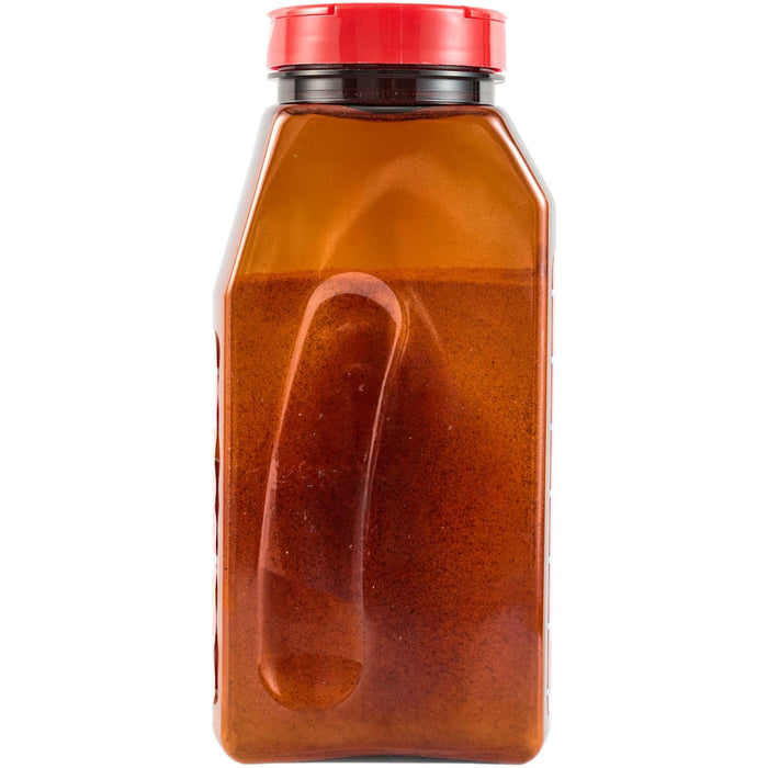 A red plastic bottle with a red lid filled with a red liquid.