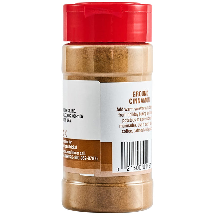 A brown spice bottle with a red flip-top lid, labeled Lawry'S Cinnamon Ground 2.37 Oz, showing product information and a barcode on its white label.