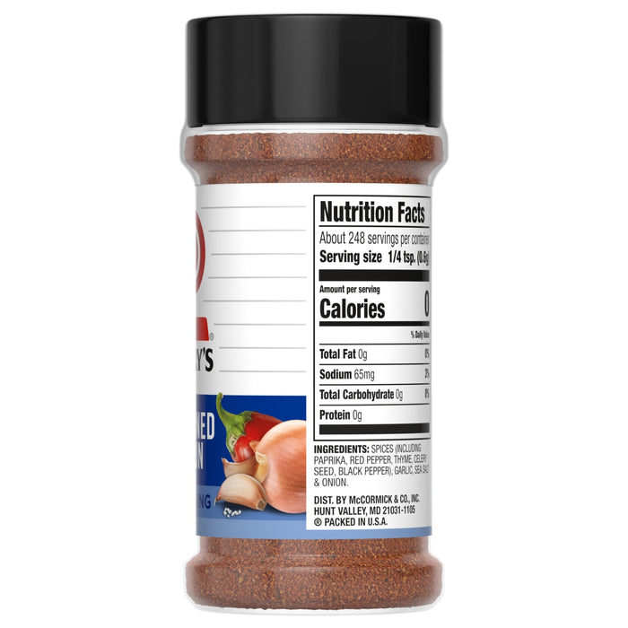 ["A McCormick's Seasoned Chicken seasoning jar with nutrition facts and ingredients listed on the label."]